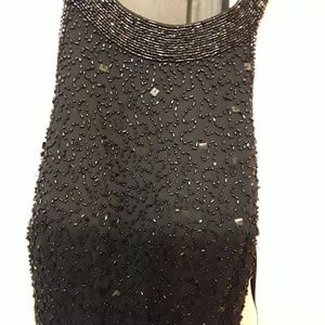 Worn once..Sequin on neck came loose as in picture